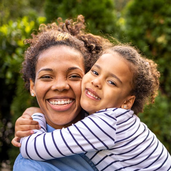 mother and daughter smiling