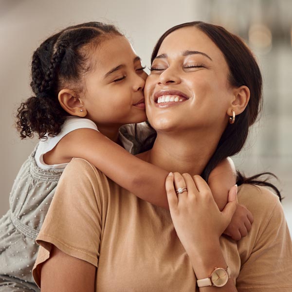 mother and daughter smiling